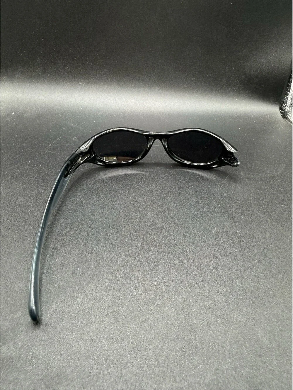 Oakley Pocket Polished Black/Black Iridium Lenses (Missing Right Arm)